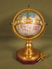 Enamelled globe clock