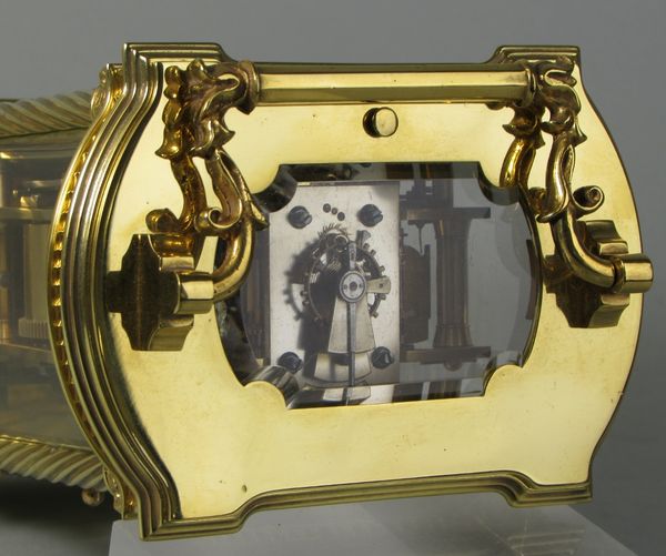 Bowed side French carriage clock with black dial