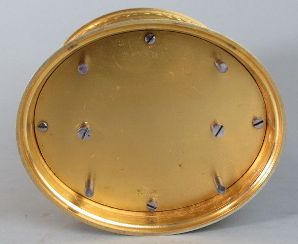 An engraved oval carriage clock