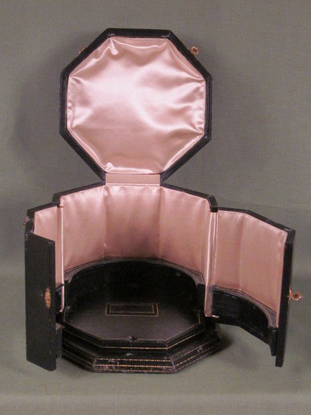 Silver and enamel novelty clock with rotating figure to show the time.    