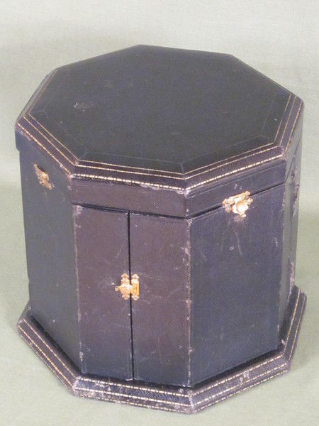 Silver and enamel novelty clock with rotating figure to show the time.    