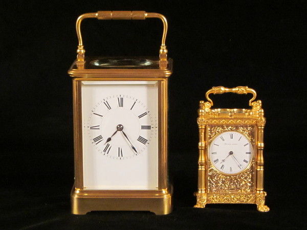 miniature engraved carriage clock on stand with malachite panels.