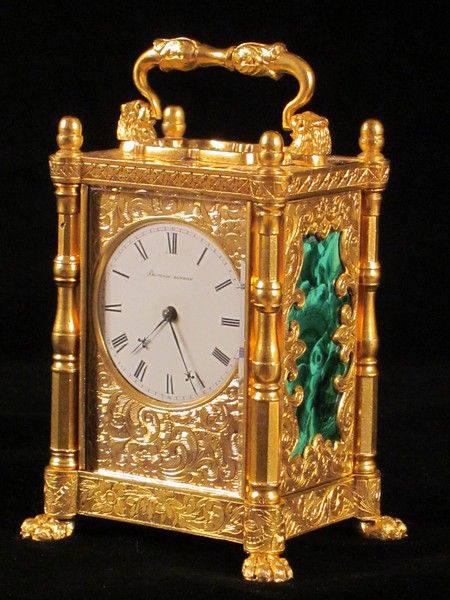 miniature engraved carriage clock on stand with malachite panels.