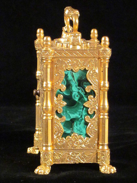 miniature engraved carriage clock on stand with malachite panels.