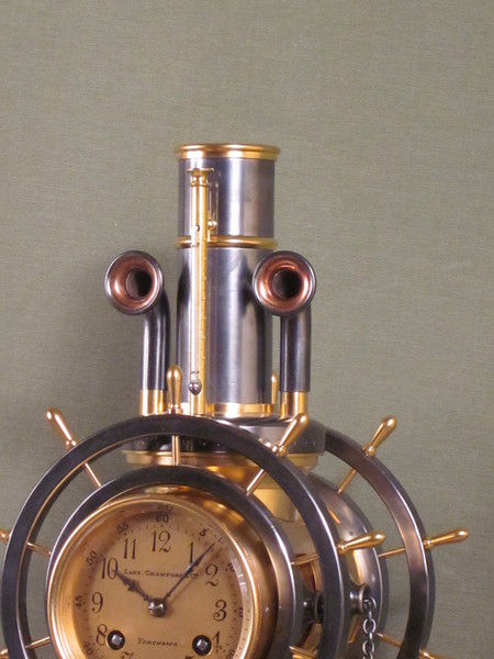 complex maritime industrial clock by Guilmet with moving ships wheels.