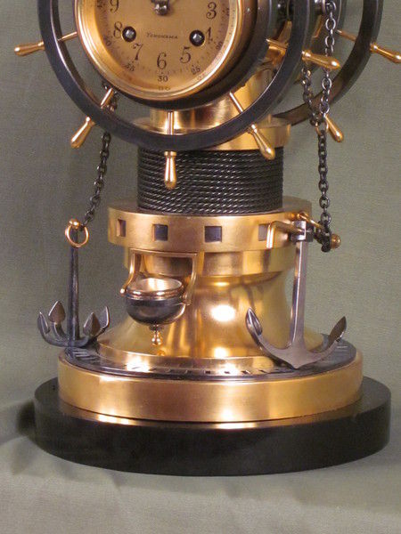 complex maritime industrial clock by Guilmet with moving ships wheels.