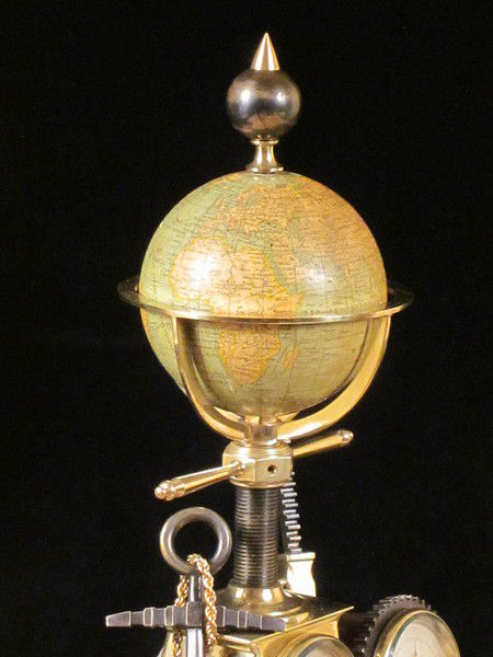 Maritime industrial clock with globe, anchor, etc.