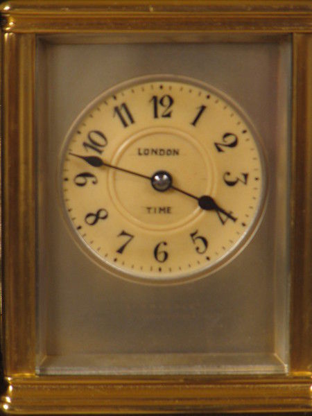 clock with dials on four sides indicating time in London,Paris, New York