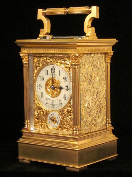 Petite sonnerie carriage clock with fretted out, engraved and gilded panels