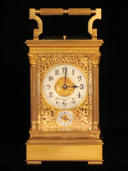 Petite sonnerie carriage clock with fretted out, engraved and gilded panels