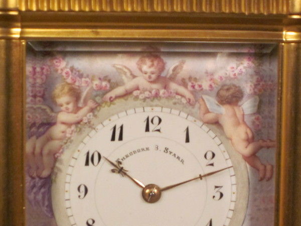 An extremely fine enamel panelled carriage clock with original box.