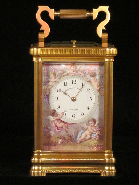 An extremely fine enamel panelled carriage clock with original box.