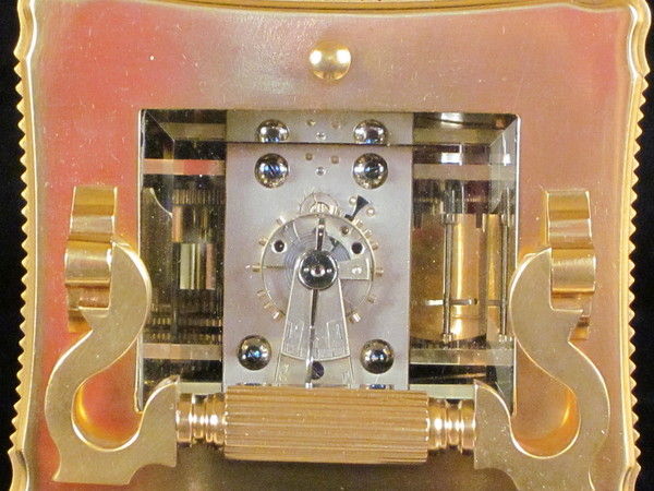 An extremely fine enamel panelled carriage clock with original box.