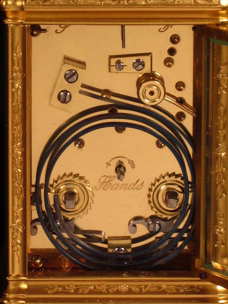 An engraved and gilded gorge cased carriage clock by Richard and Company