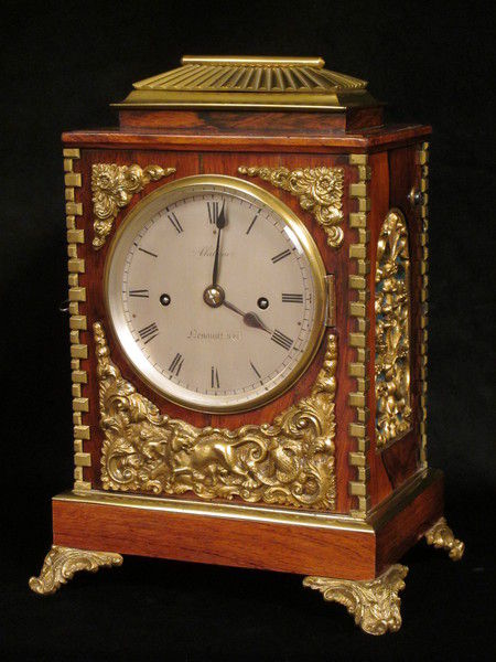 small rosewood bell striking clock with concealed handle by Alabone,1840..  