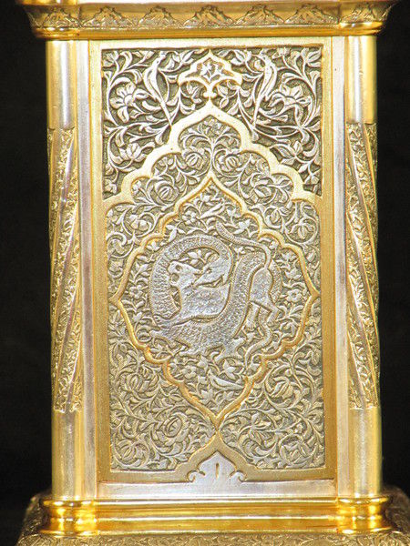 The Basilisk carriage clock, with very finely decorated metal panels. 