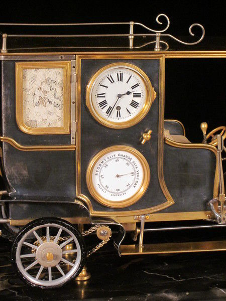 A rare automaton car clock by Guilmet, 