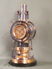 complex maritime industrial clock by Guilmet with moving ships wheels.