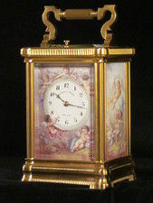 An extremely fine enamel panelled carriage clock with original box.