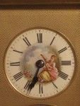 rare strike and repeat carriage clock with oval porcelain panels.  (France)