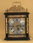 Nathaniel Hodges, A small 17th cent table clock with oak carrying case. (England)