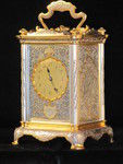 The Basilisk carriage clock, with very finely decorated metal panels.  (France)